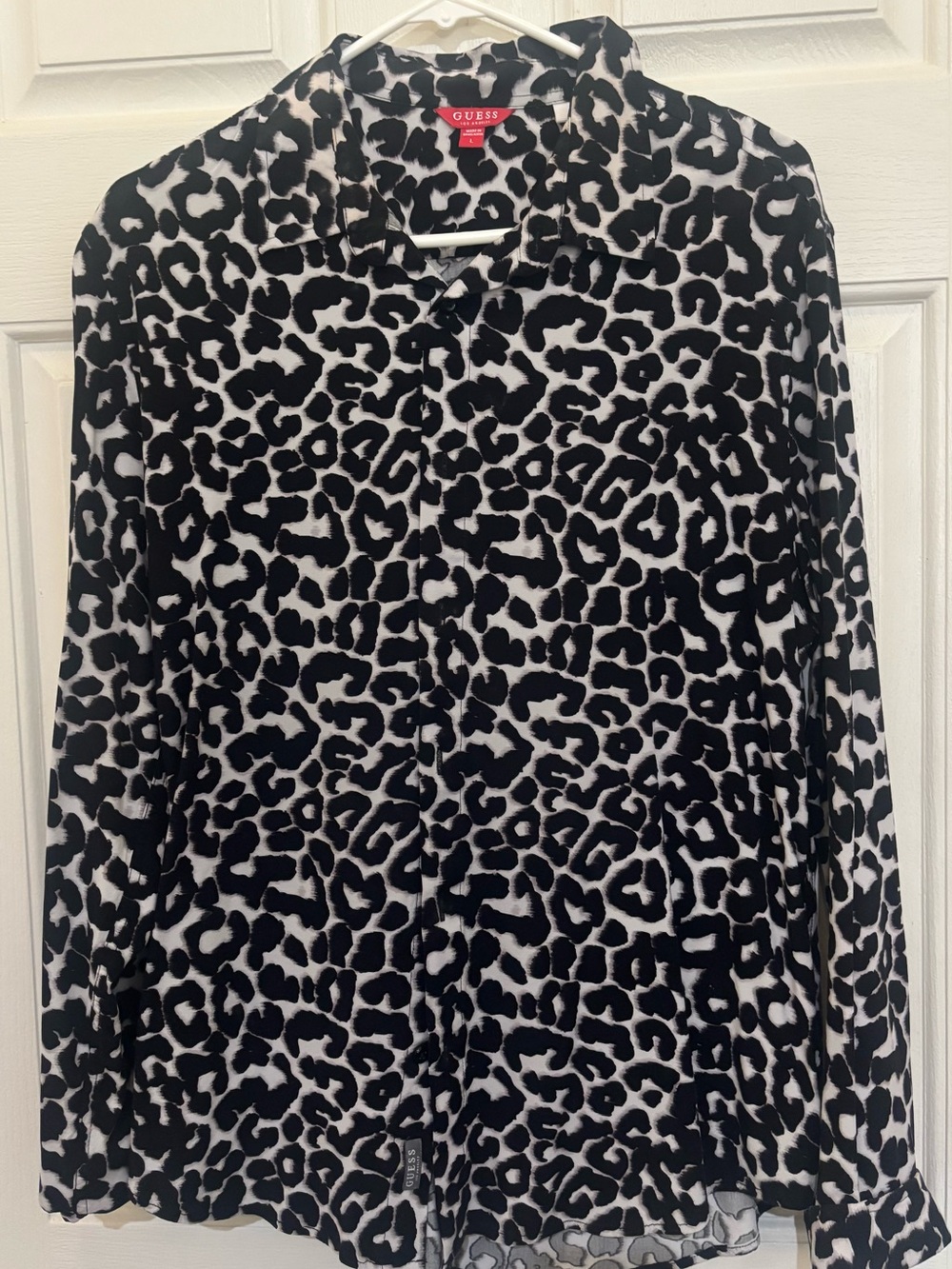 GUESS Black and White Leopard Print button up blouse.